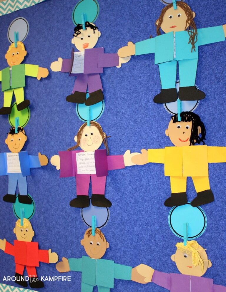 Colorful school bulletin board featuring student caricatures made from construction paper 