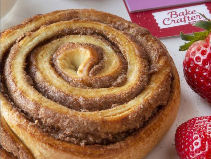 Close up of a cinnamon swirl roll from Bake Crafters, a school cafeteria food choice