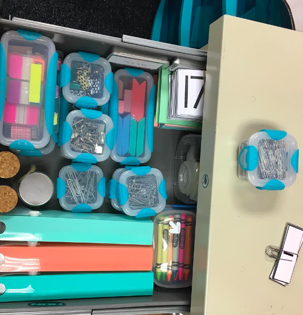 A teacher's desk drawer filled with neatly organized supplies